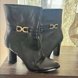 Express Black and Gold Heeled Boots with Sleek Design